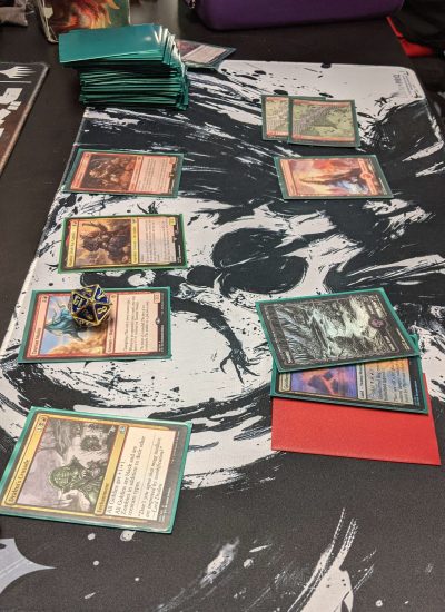 Assortment of Magic Cards on Mat